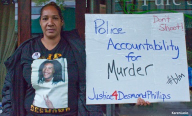 photo by Karen LasloDelphine Norman, mother of Desmond Phillips, protests outside the April 17 town hall meeting held by Rep. Doug LaMalfa.