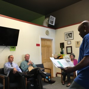 photo by Dave WaddellDavid Phillips, right, father of Desmond Phillips, talks to Police Chief Mike O'Brien and DA Mike Ramsey at today's meeting.